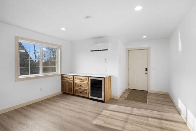 Guest suite offers a breakfast bar with beverage fridge, mini split, and an open floor plan. | Image 44