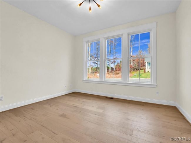 Photo represents the plan, not the actual home. Design selections may vary. Tucked off of the entryway is a private home office with French doors. | Image 9