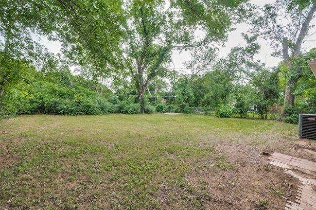View of green lawn featuring cooling unit | Image 27