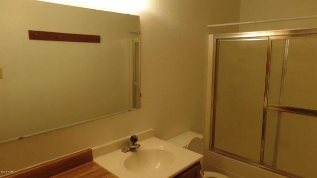 2nd full bathroom with toilet, enclosed tub / shower combo, and vanity | Image 30
