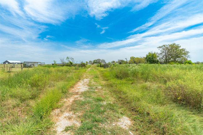 Road going to the back of property. | Image 7