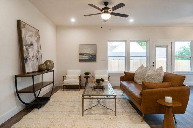 Living room featuring baseboards, wood finished floors, a ceiling fan, and recessed lighting | Image 12