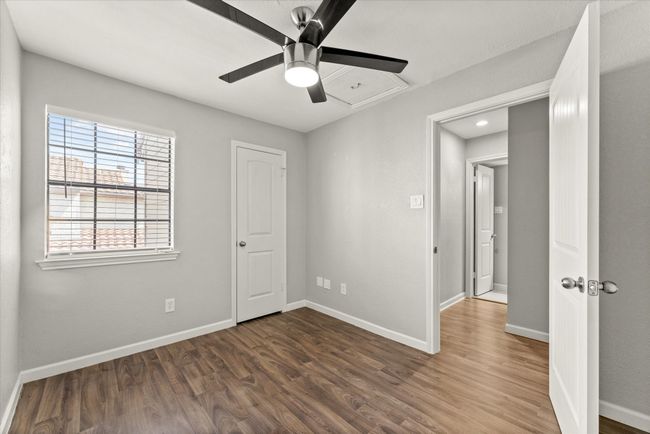 Unfurnished bedroom featuring wood finished floors and a ceiling fan | Image 22