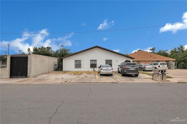 View of front of house featuring uncovered parking and fence | Image 4