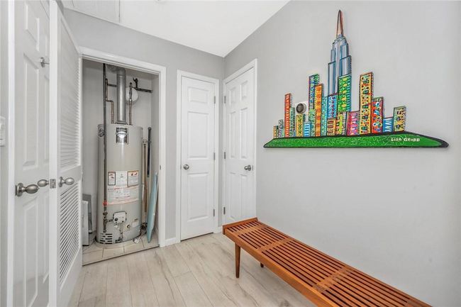 Hot water heater closet, en suite bathroom door to right in photo. | Image 17
