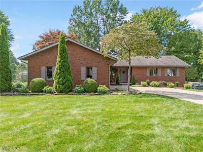 Ranch-style home with a front yard | Image 2