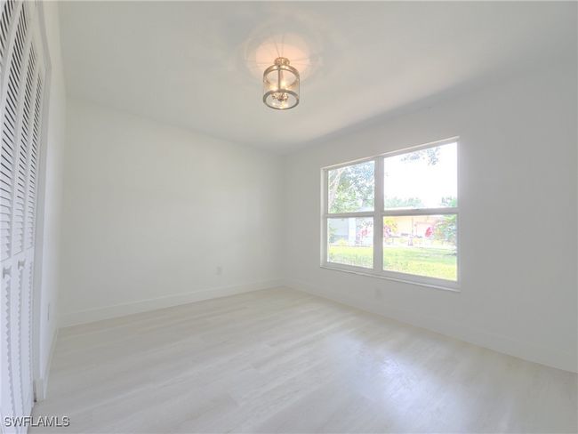 Unfurnished room with light wood finished floors and baseboards | Image 25