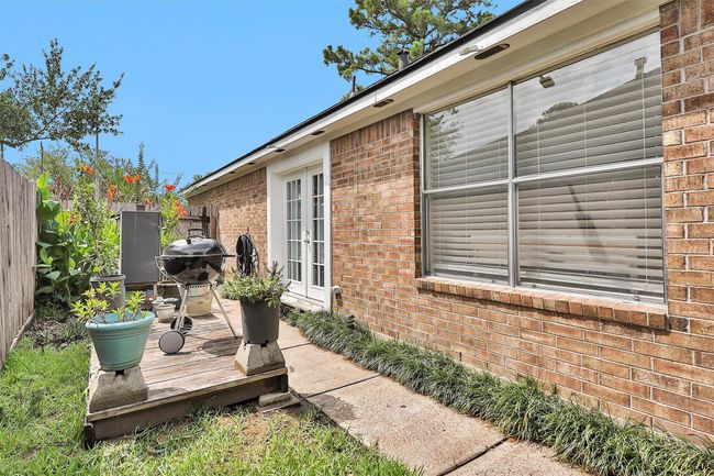 This side deck is located just outside the kitchen and breakfast area. Perfect for grilling! | Image 10