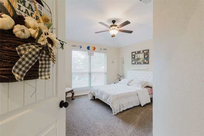 Bedroom featuring carpet flooring and ceiling fan | Image 15