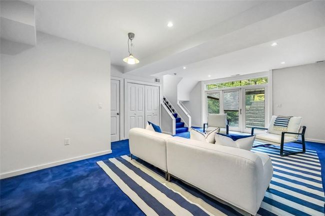 Living room with dark carpet and french doors | Image 23