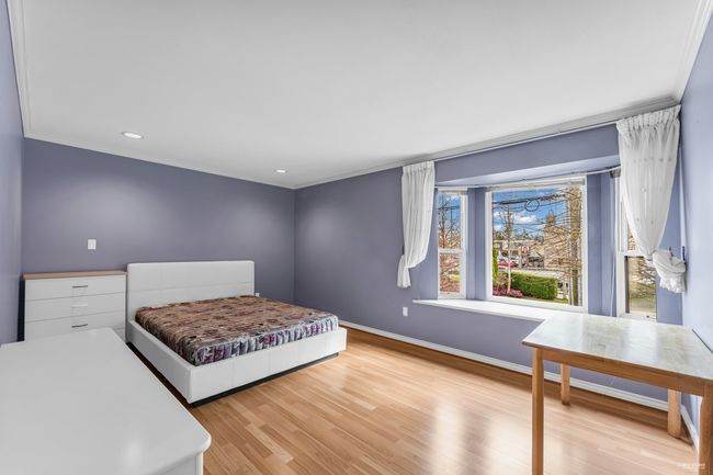Bedroom featuring recessed lighting, baseboards, crown molding, and wood finished floors | Image 18