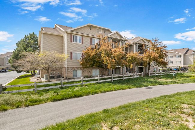 View of property with a fenced front yard and a residential view | Image 30