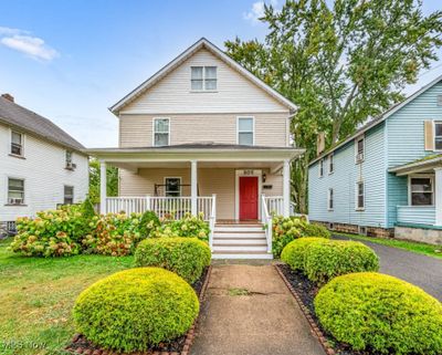 Welcoming Covered Front Porch with newer Deck and Rails. | Image 1