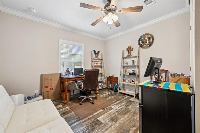 Currently being used as an office, this 3rd bedroom offers additional space for friends and family! | Image 17