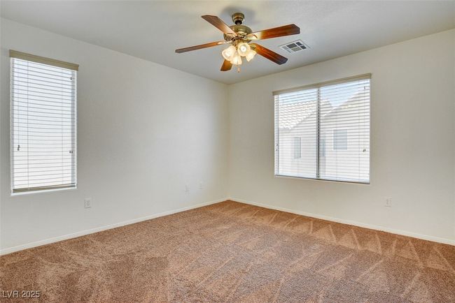 Spare room featuring baseboards, visible vents, and carpet flooring | Image 14