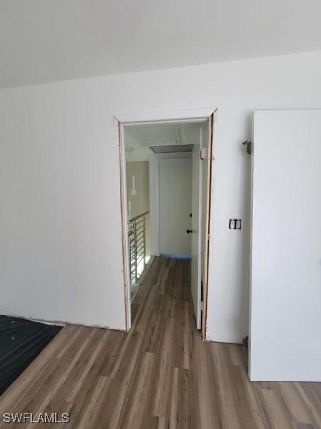 Hall with wood look vinyl tile floors | Image 20