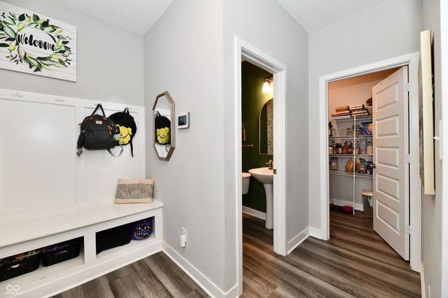 Hallway next to the kitchen - in the back you can see the walk-in pantry | Image 36
