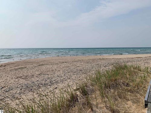 410 S Golden Beach Dr, Kewadin, MI, 49648-9221 | Card Image