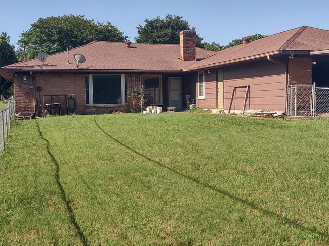 Back of house with a chimney and brick siding | Image 11