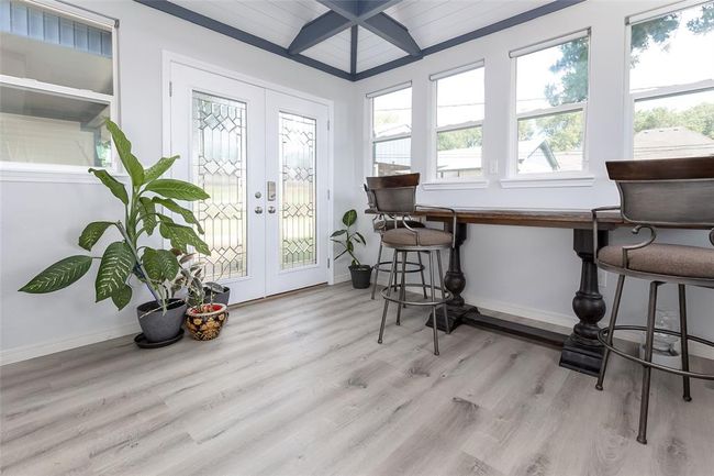Sunroom / solarium with lofted ceiling with beams and french doors | Image 30