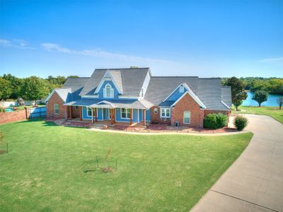 View of swimming pool featuring a gazebo, an in ground hot tub, ceiling fan, and a patio area | Image 2