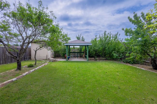 View of yard featuring a patio area, a gazebo, and fence private yard | Image 21