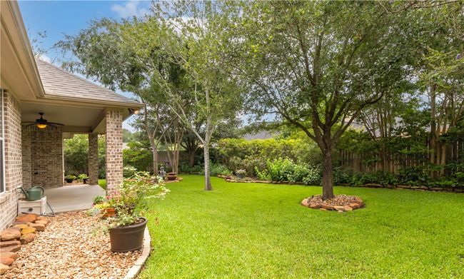 View of yard with a ceiling fan and a patio | Image 37
