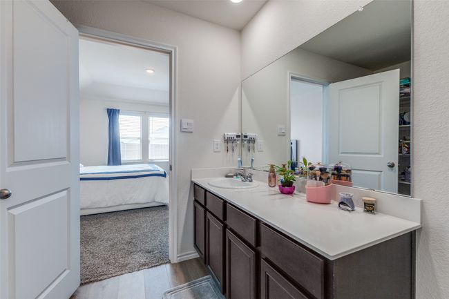 Bathroom featuring vanity, ensuite bathroom, and wood finished floors | Image 15