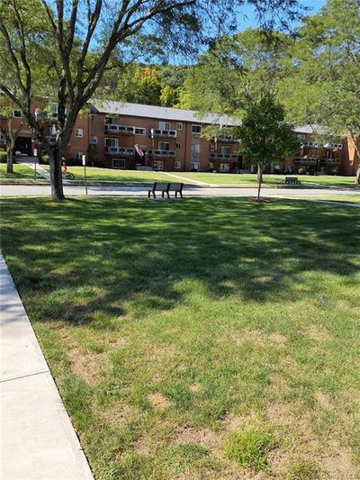 View of property's community featuring a yard | Image 2