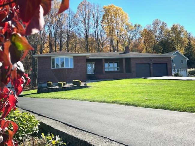 View of front of house with a front yard and a garage | Image 30