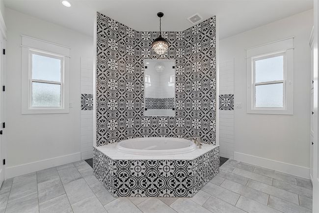 Full bath featuring a tile shower, tiled tub, tile patterned flooring, baseboards, and visible vents | Image 11
