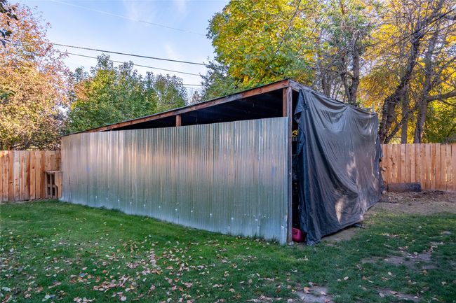 View of outdoor structure with a lawn | Image 34