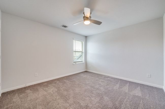 Spare room featuring carpet flooring and a ceiling fan | Image 10