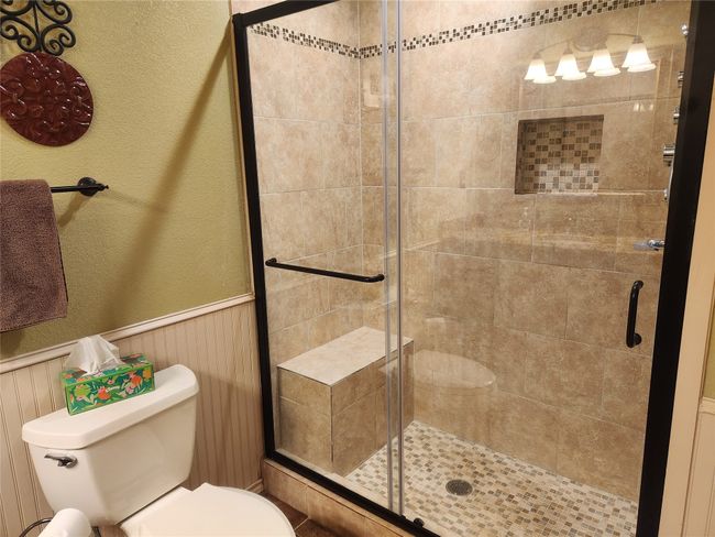 Bathroom featuring walk-in shower | Image 20