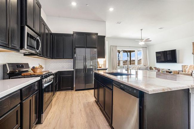 The kitchen is central to the home | Image 8