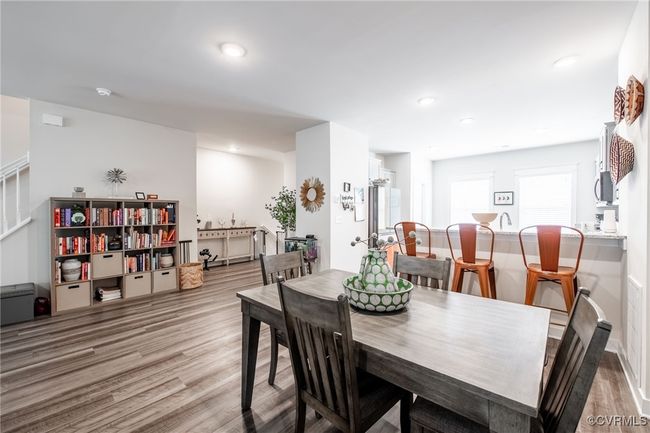 Dining area with light wood-style flooring and recessed lighting | Image 13