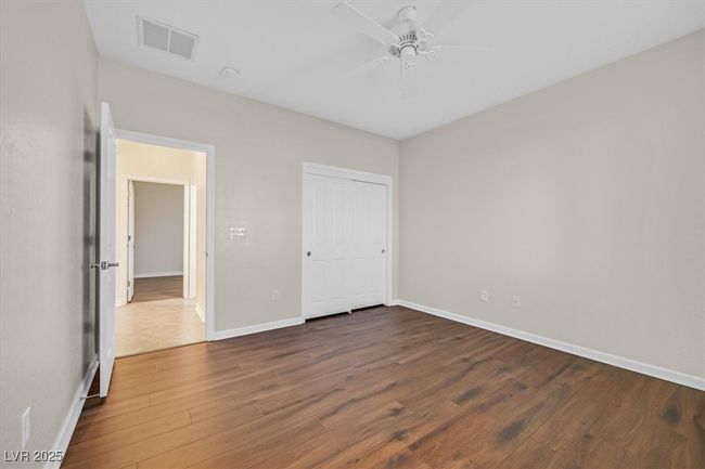 bedroom with a closet, LVP flooring, and ceiling fan | Image 20