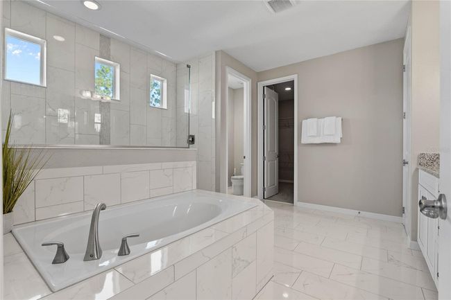 Primary bath, walk-in shower, garden tub, walk-in closet | Image 30