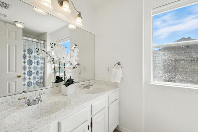 Full bathroom featuring double vanity | Image 26
