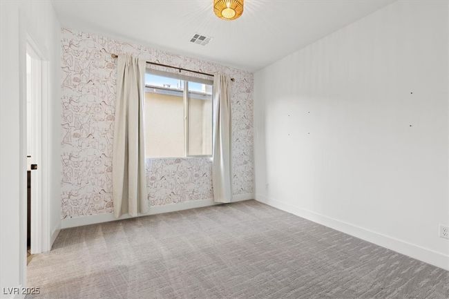 Spare room with visible vents, wallpapered walls, carpet floors, and baseboards | Image 41