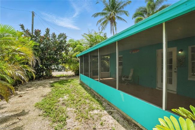 View of yard featuring a sunroom | Image 31