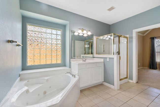 Sink area number 2 in between the separate tub and shower | Image 26