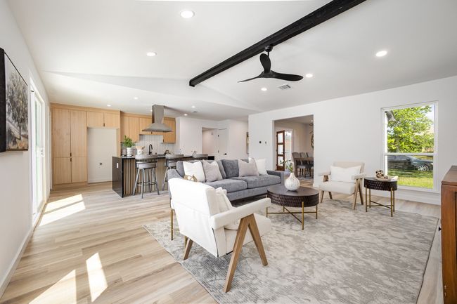 Living area featuring light wood-style flooring, recessed lighting, and lofted ceiling with beams | Image 14