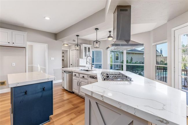 Light and airy kitchen with a stunning view to the backyard pool | Image 15