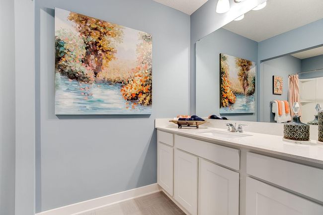 Those bedrooms each have easy access to this deep and spacious bathroom! Photo of model home, color & options may vary. | Image 23
