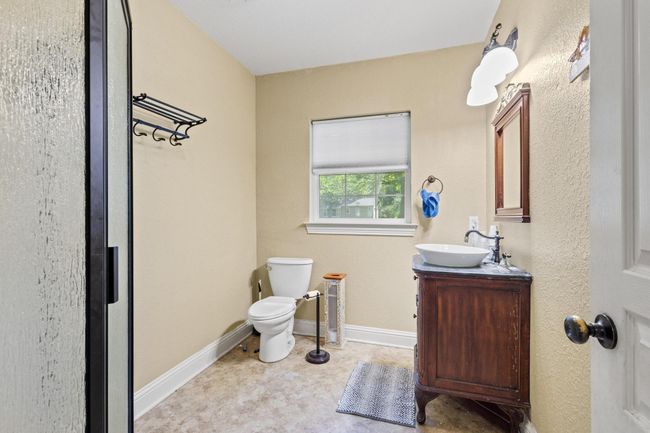 Half bath featuring baseboards, toilet, and vanity | Image 30