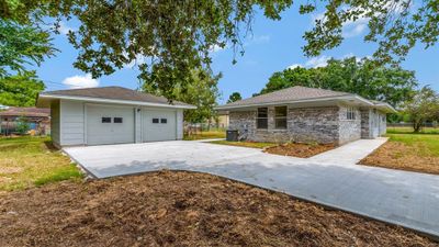 Great 2 Car Garage. Notice the additional parking. | Image 3