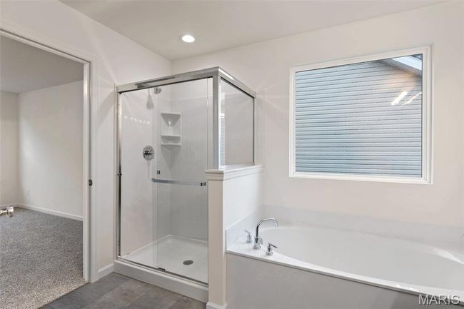 Bathroom with a bath, a shower stall, and recessed lighting | Image 17