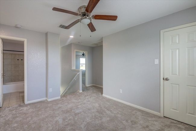 Open loft area at the top of the stairs. Can be used as a second living space or an office. | Image 19