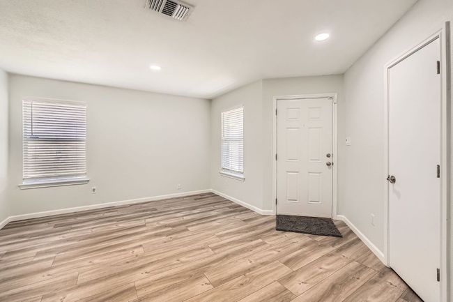 Entrance foyer featuring baseboards, recessed lighting, light wood-style floors, and visible vents | Image 7